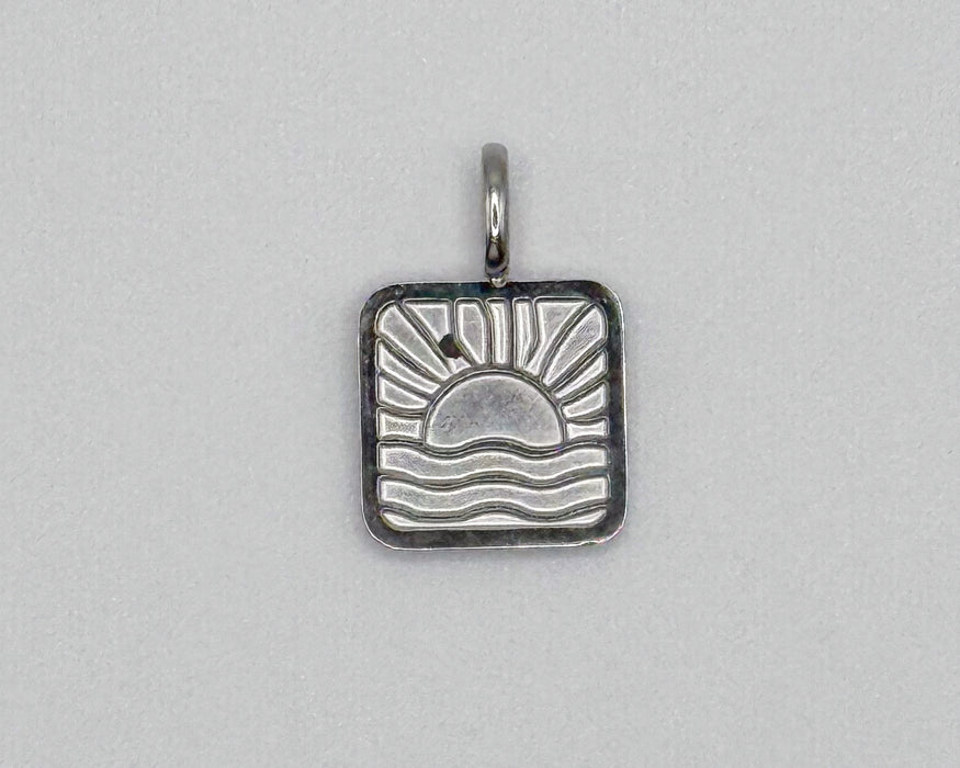 Stainless steel silver sun and waves charm