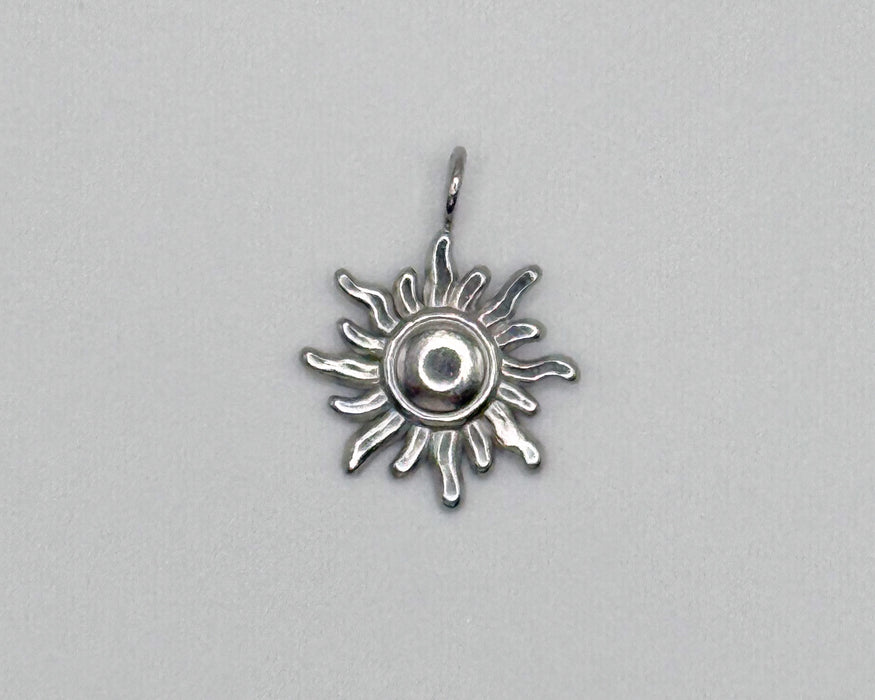 Stainless steel sun charm with radiating rays